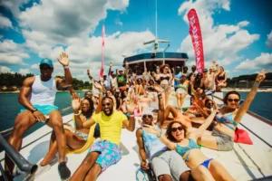 Tourists enjoying the Big Daddy Yacht Party in Pattaya, Thailand – dancing and partying on a luxury yacht in the open sea