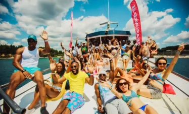 Tourists enjoying the Big Daddy Yacht Party in Pattaya, Thailand – dancing and partying on a luxury yacht in the open sea