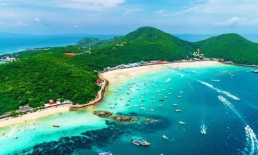 Scenic beach view at Coral Island (Koh Larn) with clear blue water and white sand