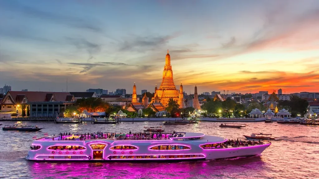 Chao Phraya Dinner Cruise at sunset with Wat Arun