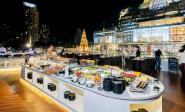 Thai and international buffet setup with elegant dinner tables on Opulence cruise