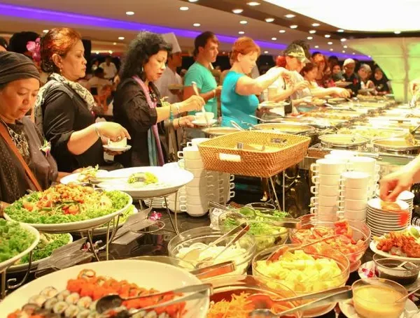Guests enjoying buffet dinner inside Chao Phraya Princess Cruise in Bangkok