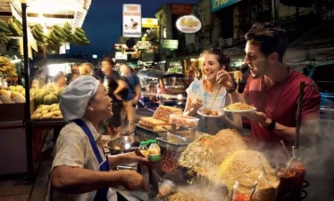 Authentic Thai meal including Tom Yum soup, Pad Thai, and mango sticky rice