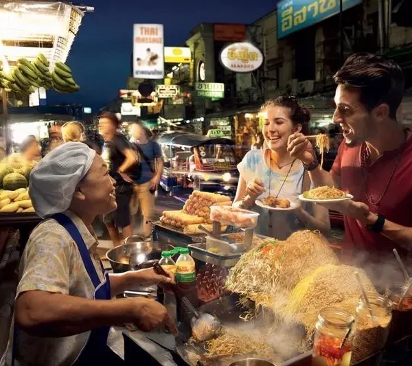 Authentic Thai meal including Tom Yum soup, Pad Thai, and mango sticky rice