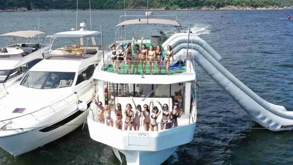 Distant view of Big Daddy yacht party in Pattaya with people enjoying on deck in the sea