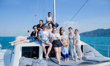 ourists and girls enjoying a lively yacht party on the deck with ocean views