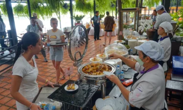 Buffet lunch setup at Nong Nooch Garden restaurant with Thai dishes
