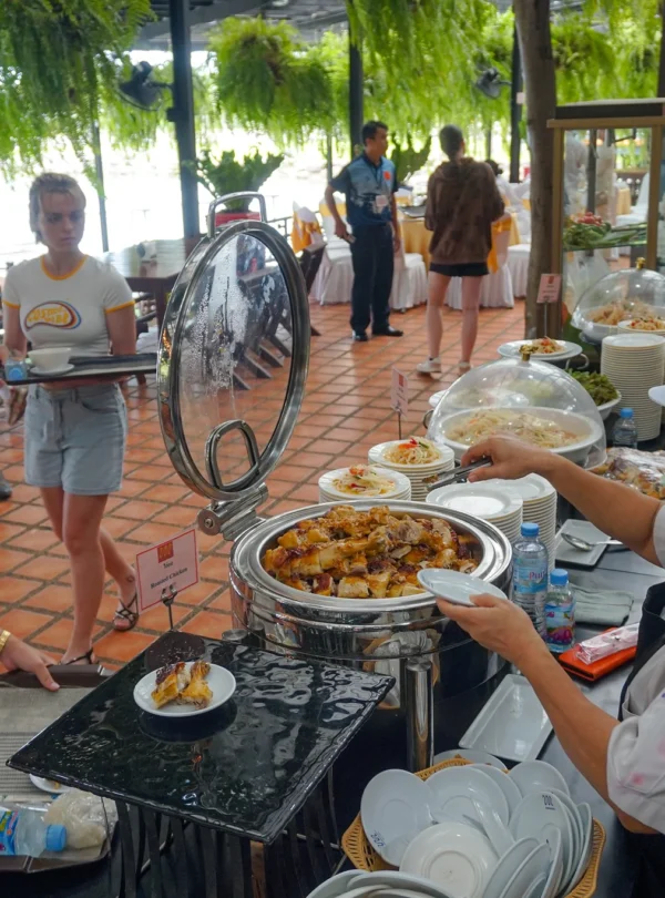 Buffet lunch setup at Nong Nooch Garden restaurant with Thai dishes