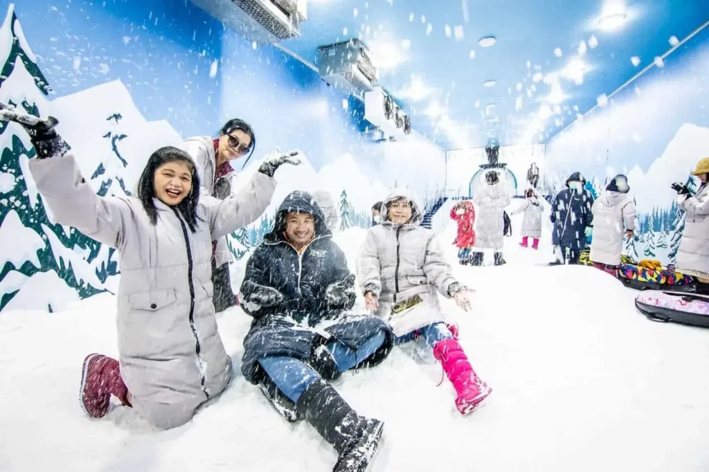 Children playing in the Snow Dome with artificial snow