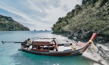 Traditional Thai long tail boat sailing near the 4 Islands in Krabi