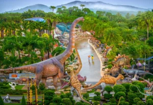 Aerial view of Nong Nooch Tropical Garden with dinosaur statues and walking tourists