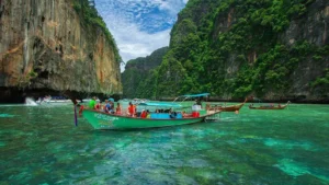 Scenic view of long-tail boats at Maya Bay, Phi Phi Island