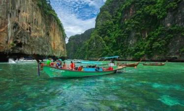 Scenic view of long-tail boats at Maya Bay, Phi Phi Island