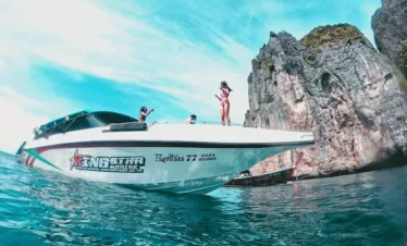 Tourists boarding speedboat for Phi Phi Island adventure