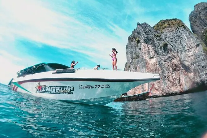 Tourists boarding speedboat for Phi Phi Island adventure