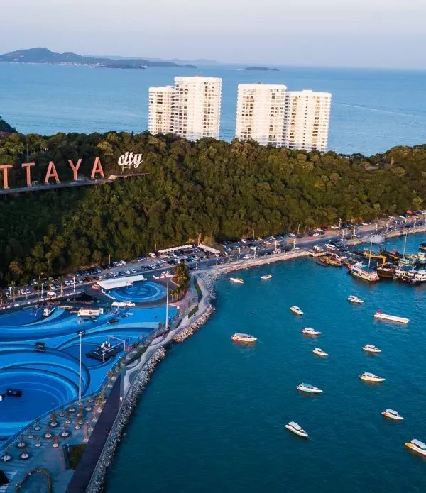 Pattaya beach view with the iconic Pattaya City sign and skyline in the background