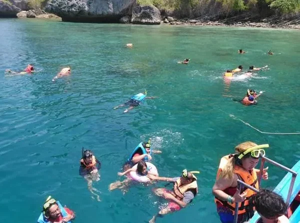 Tourists snorkeling in clear waters during the 4 Islands tour in Krabi