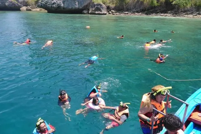 Tourists snorkeling in clear waters during the 4 Islands tour in Krabi