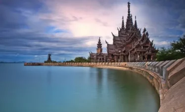 The Sanctuary of Truth Pattaya wooden temple exterior by the sea