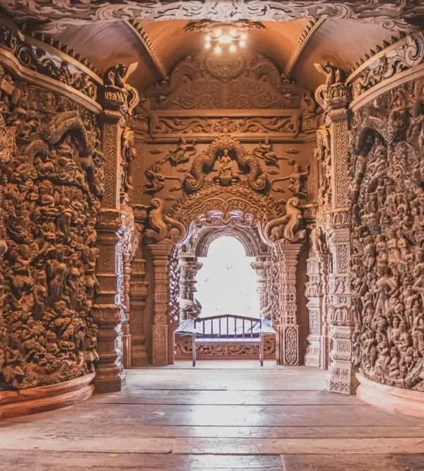 Intricate wood carvings inside The Sanctuary of Truth Pattaya