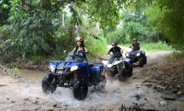 Rider enjoying ATV Kart adventure on muddy trail in Pattaya