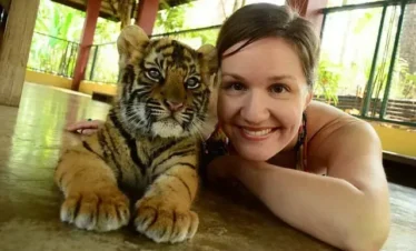 playing with a small tiger at Tiger Kingdom Phuket