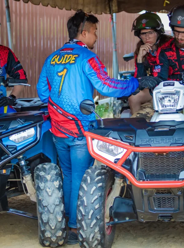 ATV riders receiving safety instructions before ride in Pattaya