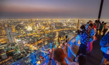 Stunning night skyline of Bangkok as seen from Mahanakhon Skywalk rooftop