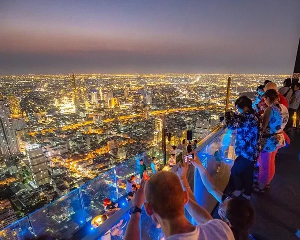 Stunning night skyline of Bangkok as seen from Mahanakhon Skywalk rooftop