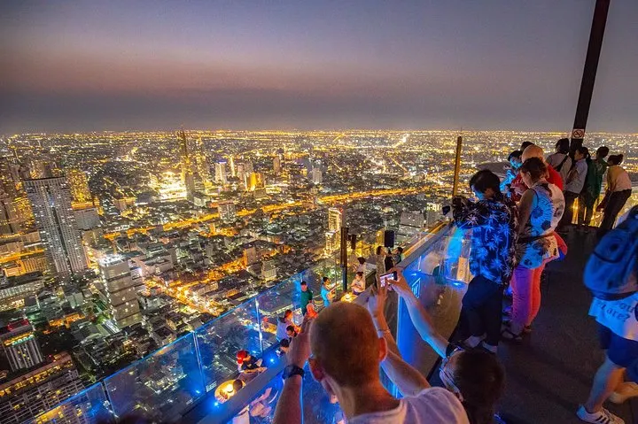Stunning night skyline of Bangkok as seen from Mahanakhon Skywalk rooftop