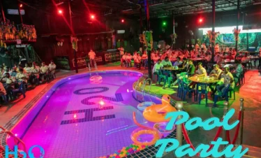 Live DJ spinning music during a pool party at H2O Pool Pattaya