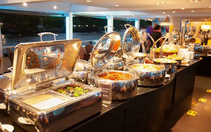 Thai and international buffet dinner setup on The Planet Cruise
