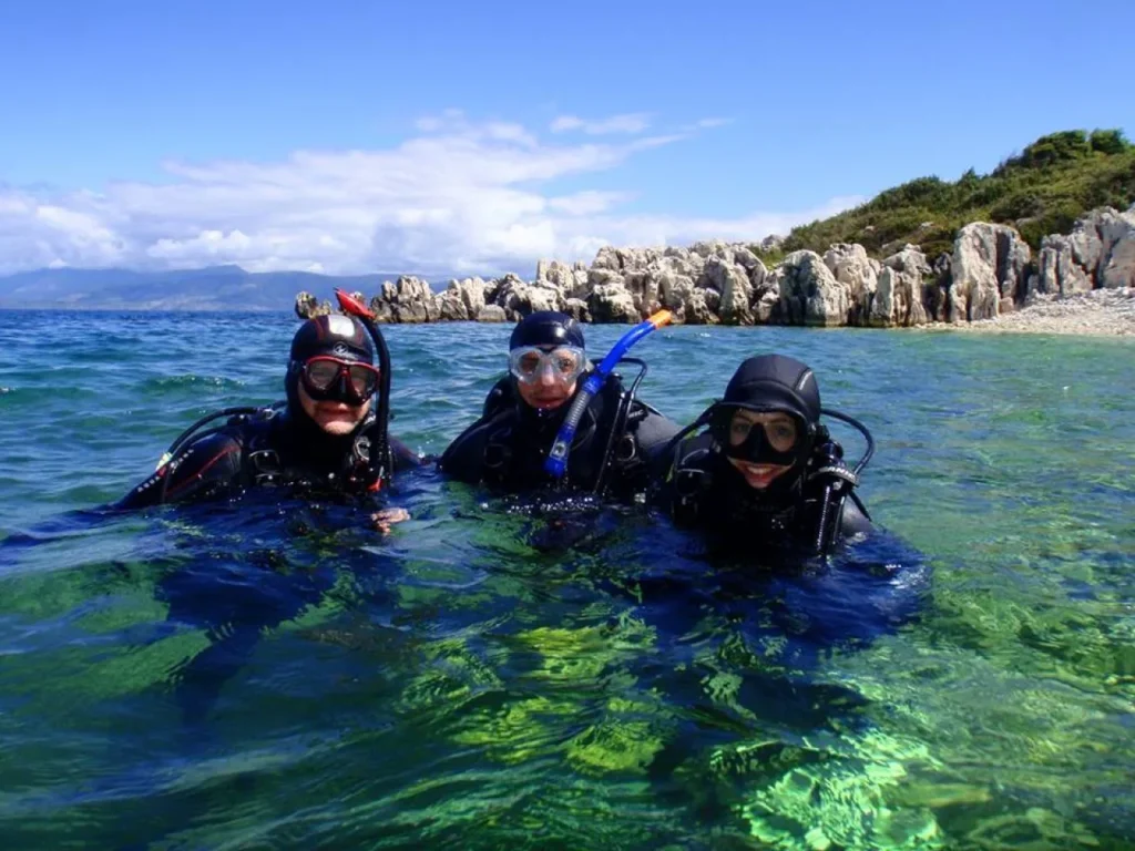 Beginner diver underwater in Pattaya during try scuba experience with instructor