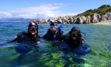 Beginner diver underwater in Pattaya during try scuba experience with instructor