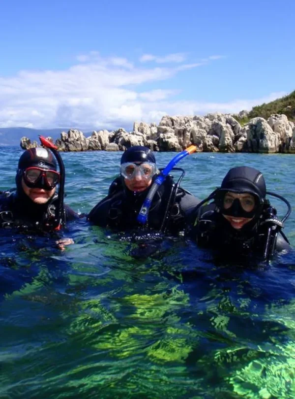 Beginner diver underwater in Pattaya during try scuba experience with instructor