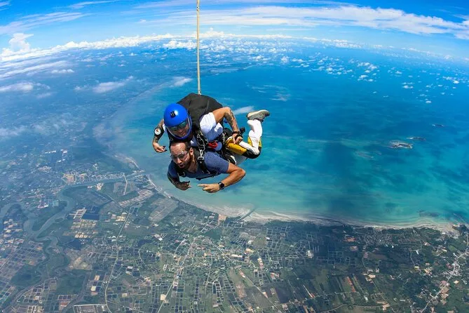 Skydiver freefalling over Pattaya coastline from 14,000 feet in Thailand