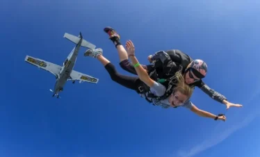 jump with instructor plane in the background Khao Yai