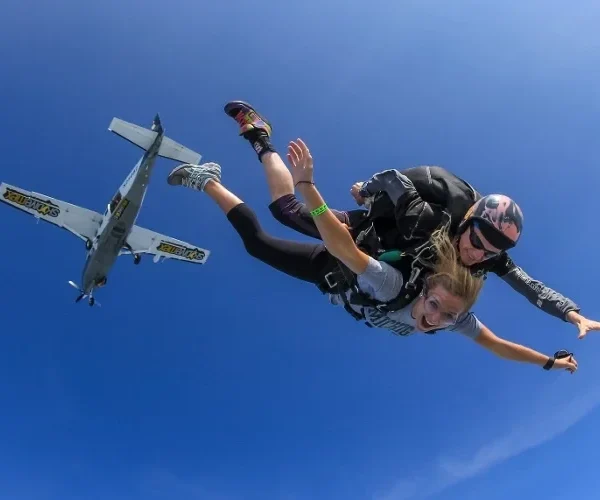 jump with instructor plane in the background Khao Yai