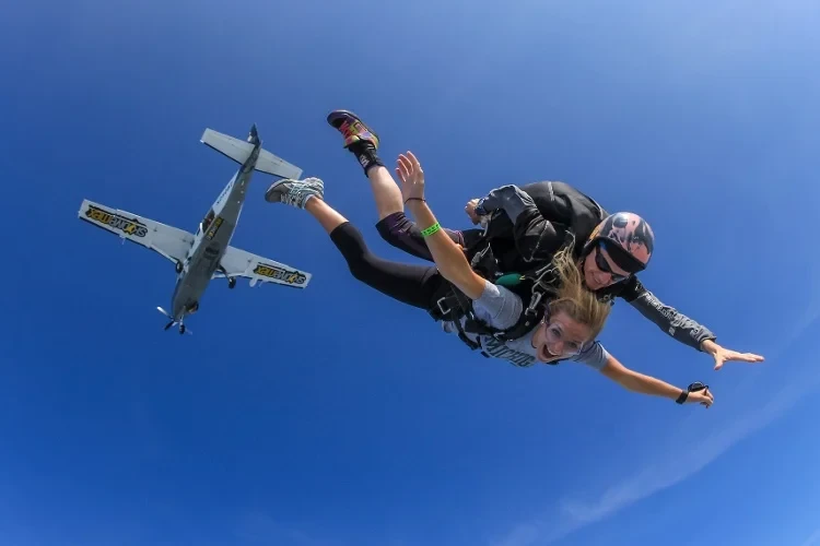 jump with instructor plane in the background Khao Yai