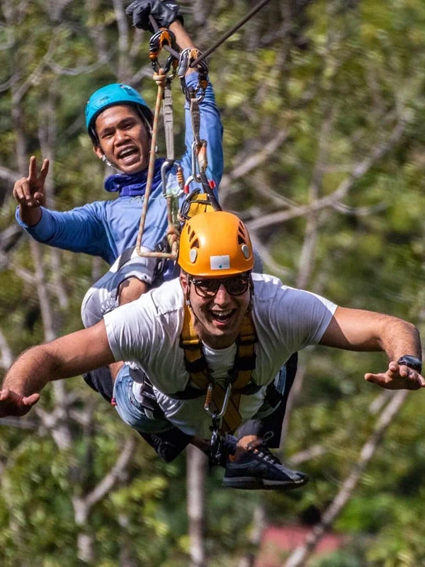Guests navigating rope challenges at Tarzan Adventure Phuket jungle course