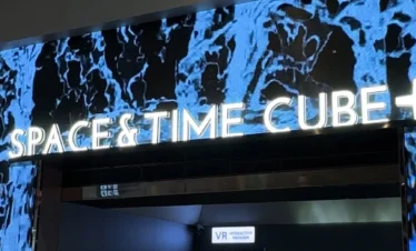 Visitors enjoying the 360° Rail Cinema experience at Space & Time Cube Bangkok