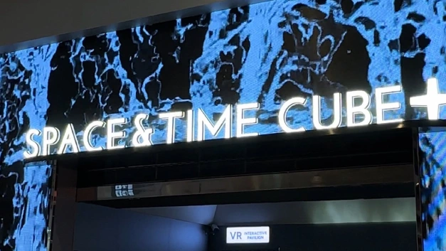 Visitors enjoying the 360° Rail Cinema experience at Space & Time Cube Bangkok