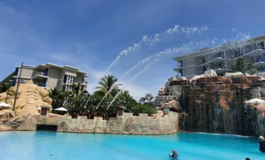 Kids having fun on a water ride at a theme park in Thailand