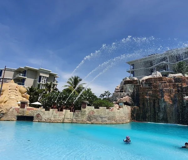 Kids having fun on a water ride at a theme park in Thailand