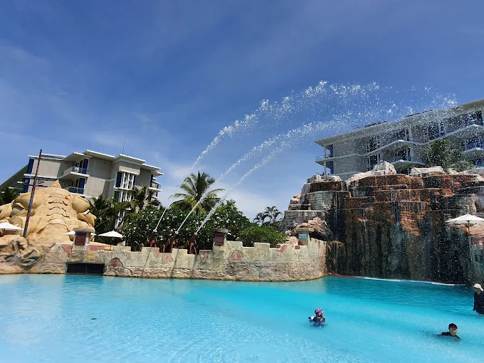 Kids having fun on a water ride at a theme park in Thailand