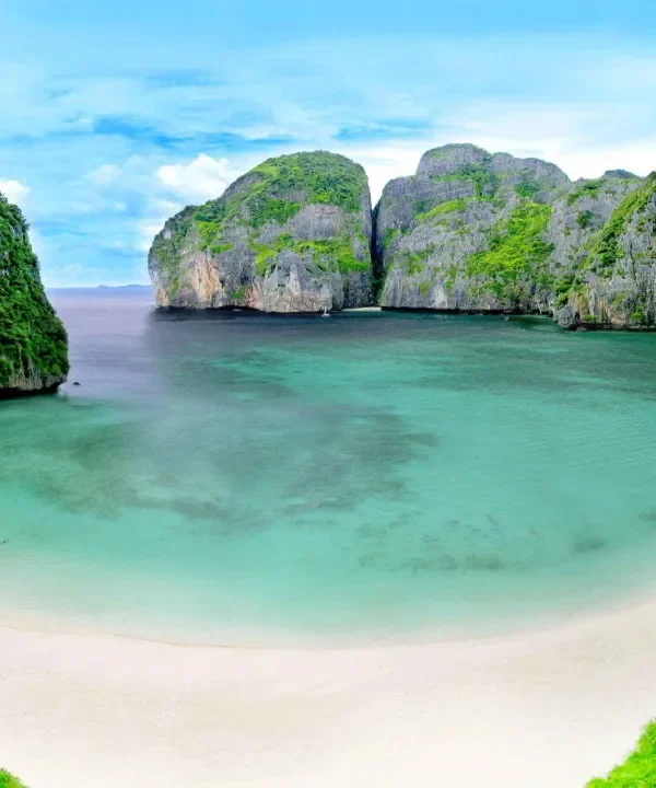 Aerial view of the turquoise waters and limestone cliffs of the Phi Phi Islands in Thailand.