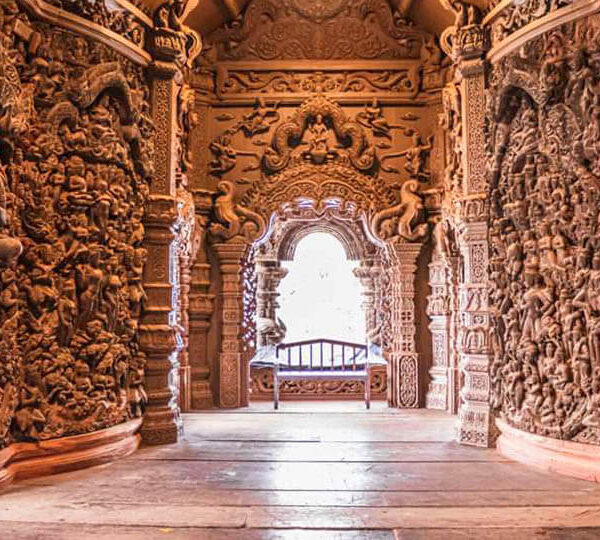 Intricate wooden carvings inside the Sanctuary of Truth Pattaya temple