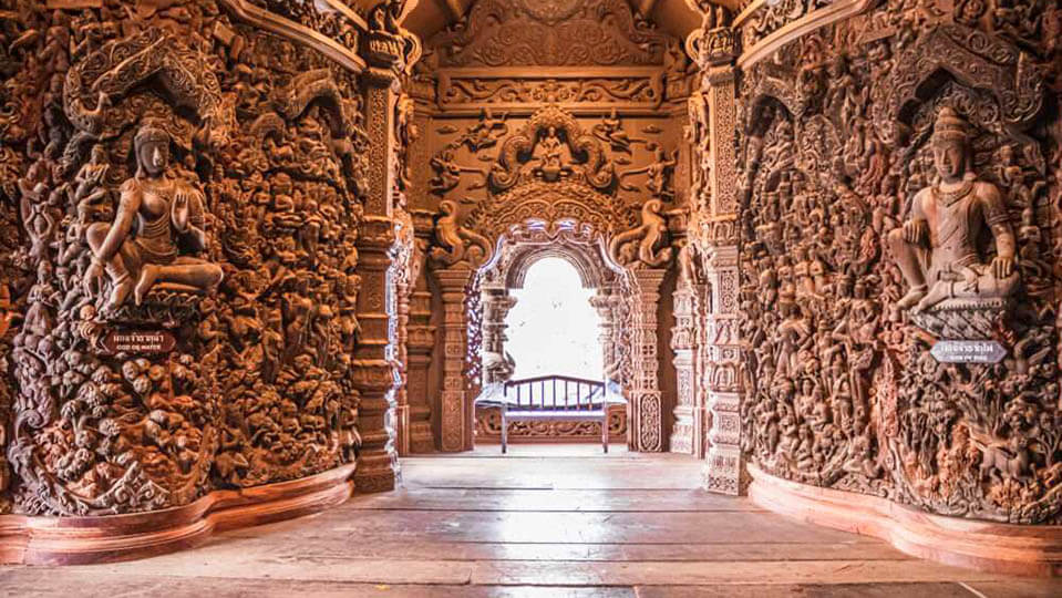 Intricate wooden carvings inside the Sanctuary of Truth Pattaya temple