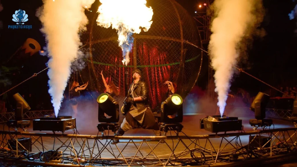 Dramatic stage performance with lights and fire effects at Phuket Circus show in Thailand