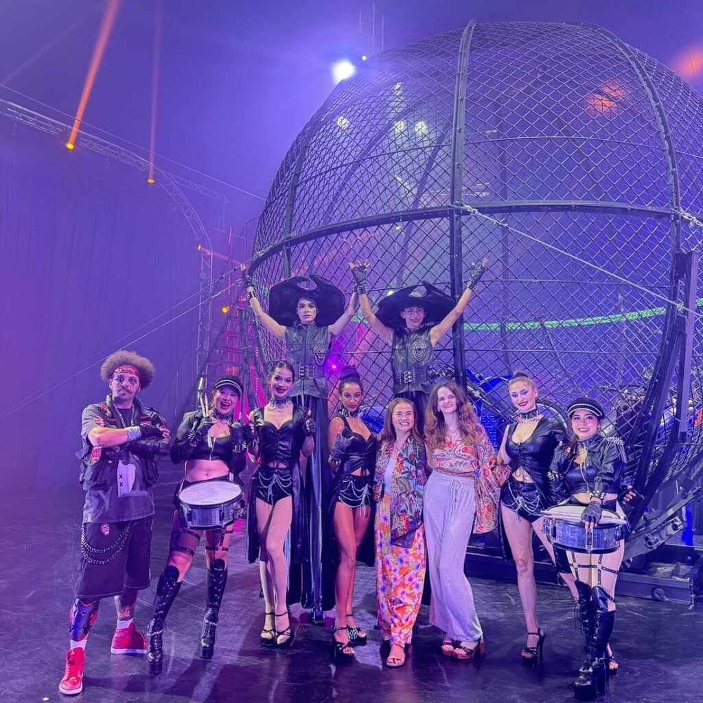 Audience taking picture with artists exciting Phuket Circus live performance in indoor theater